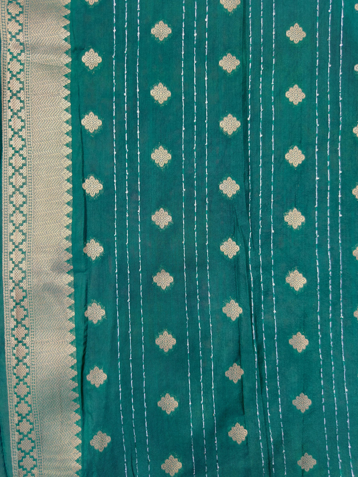 Woman wearing a Raw Mango Silk Saree with rich handloom texture and subtle sheen – perfect for weddings and festive occasions.