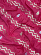 Woman wearing a Raw Mango Silk Saree with rich handloom texture and subtle sheen – perfect for weddings and festive occasions.