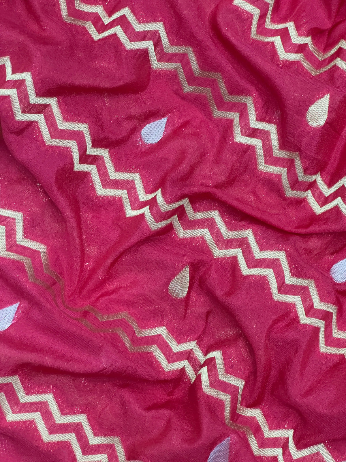 Woman wearing a Raw Mango Silk Saree with rich handloom texture and subtle sheen – perfect for weddings and festive occasions.