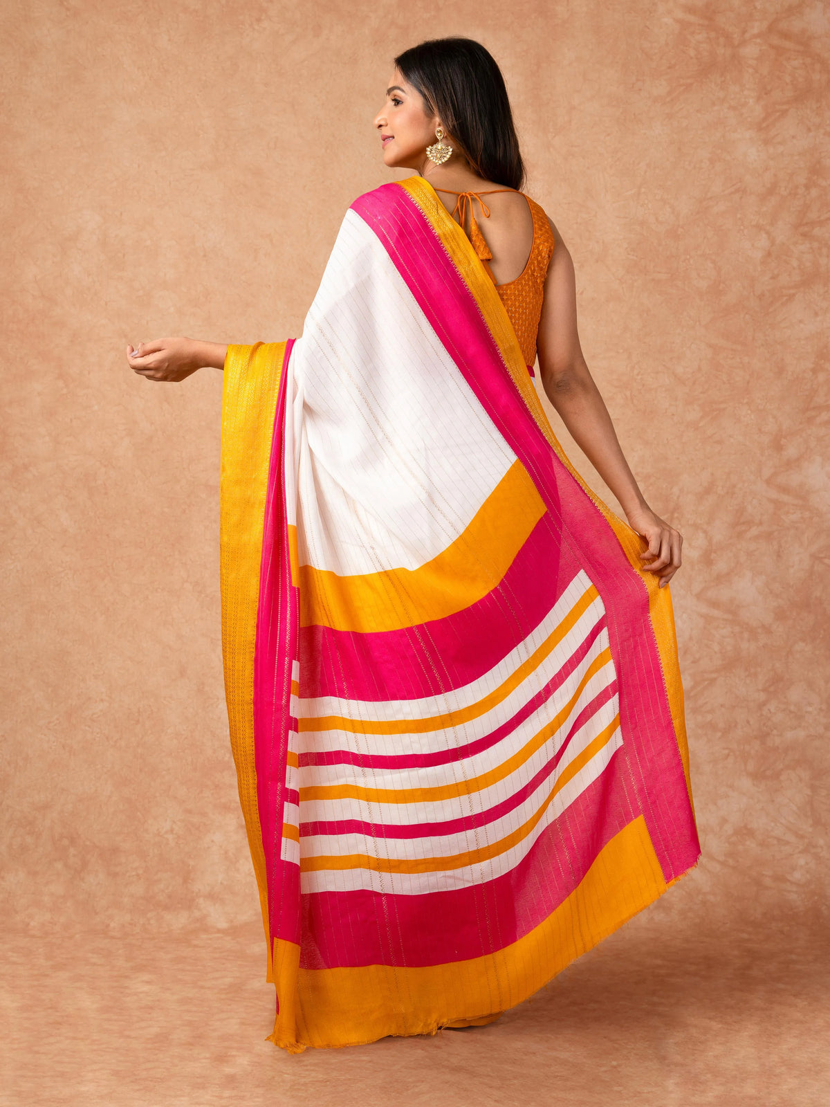 Woman draped in a Scarlet Chiffon Saree with vibrant red color and lightweight, flowy texture, perfect for weddings and festive events.