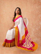Woman draped in a Scarlet Chiffon Saree with vibrant red color and lightweight, flowy texture, perfect for weddings and festive events.