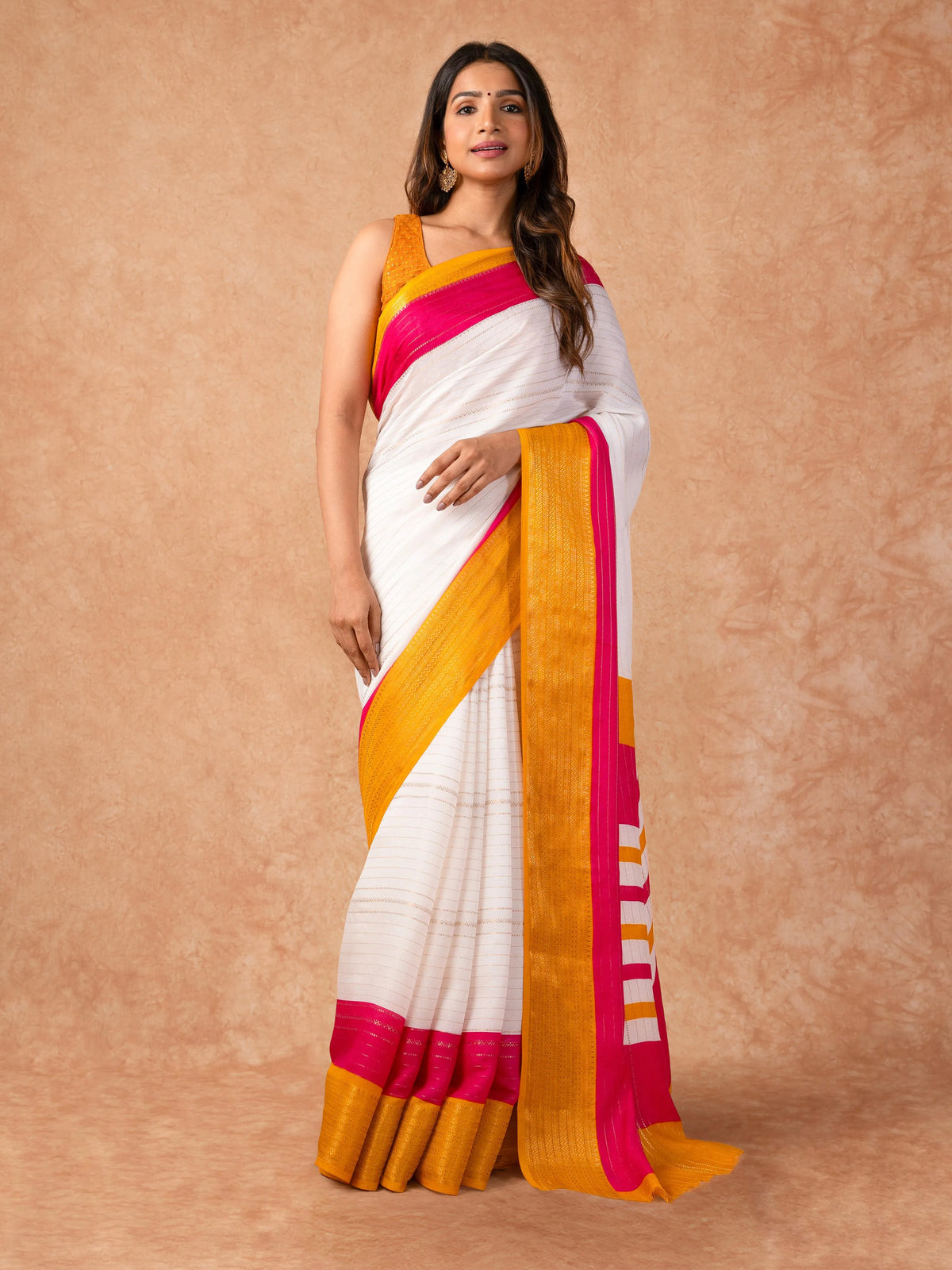 Woman draped in a Scarlet Chiffon Saree with vibrant red color and lightweight, flowy texture, perfect for weddings and festive events.