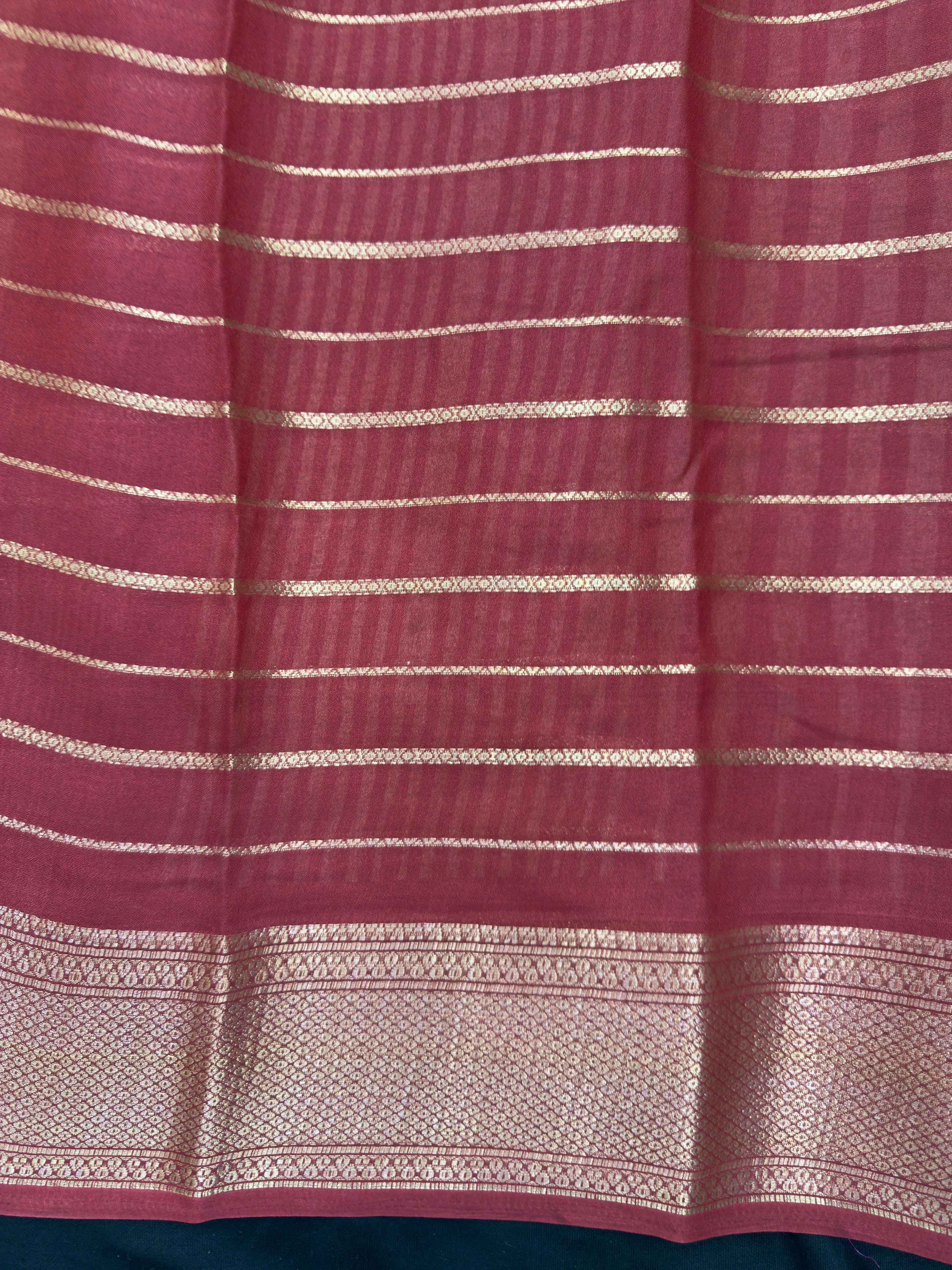 Woman draped in a Scarlet Chiffon Silk Saree with soft, flowing texture and elegant red hue, ideal for parties and festive occasions.