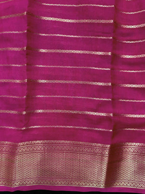 Woman draped in a Scarlet Chiffon Silk Saree with soft, flowing texture and elegant red hue, ideal for parties and festive occasions.