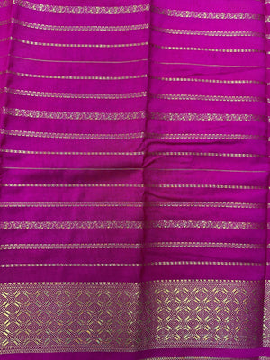 A beautifully draped Semi Banarasi Georgette Saree featuring delicate patterns and a lightweight, breathable fabric, perfect for daily wear. Timeless style and comfort combined.