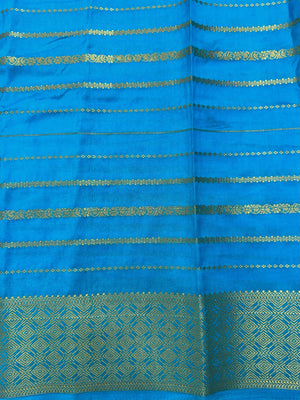 A beautifully draped Semi Banarasi Georgette Saree featuring delicate patterns and a lightweight, breathable fabric, perfect for daily wear. Timeless style and comfort combined.