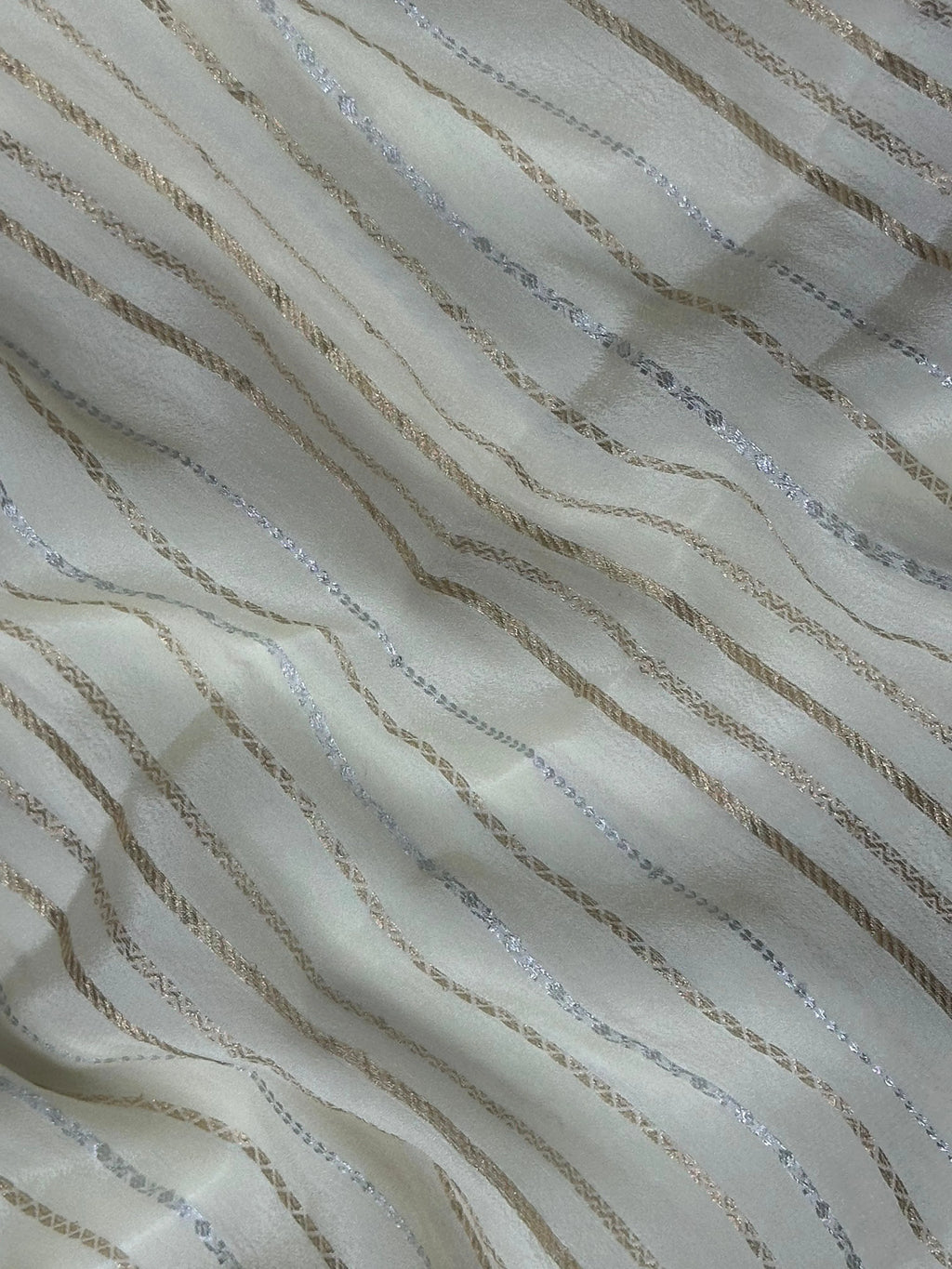 Woman draped in a Chiffon Silk Saree with soft, flowy texture and subtle sheen, perfect for parties and elegant ethnic occasions.
