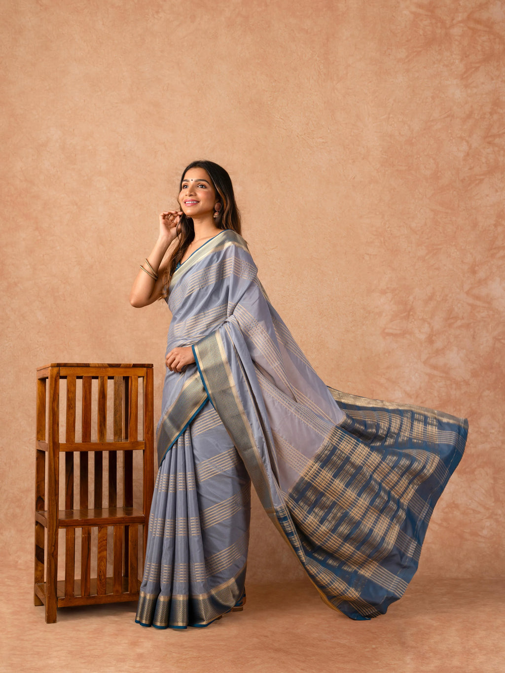 Woman wearing a Semi Crepe Silk Saree with soft drape and subtle shine, ideal for office, family gatherings, and festive occasions.