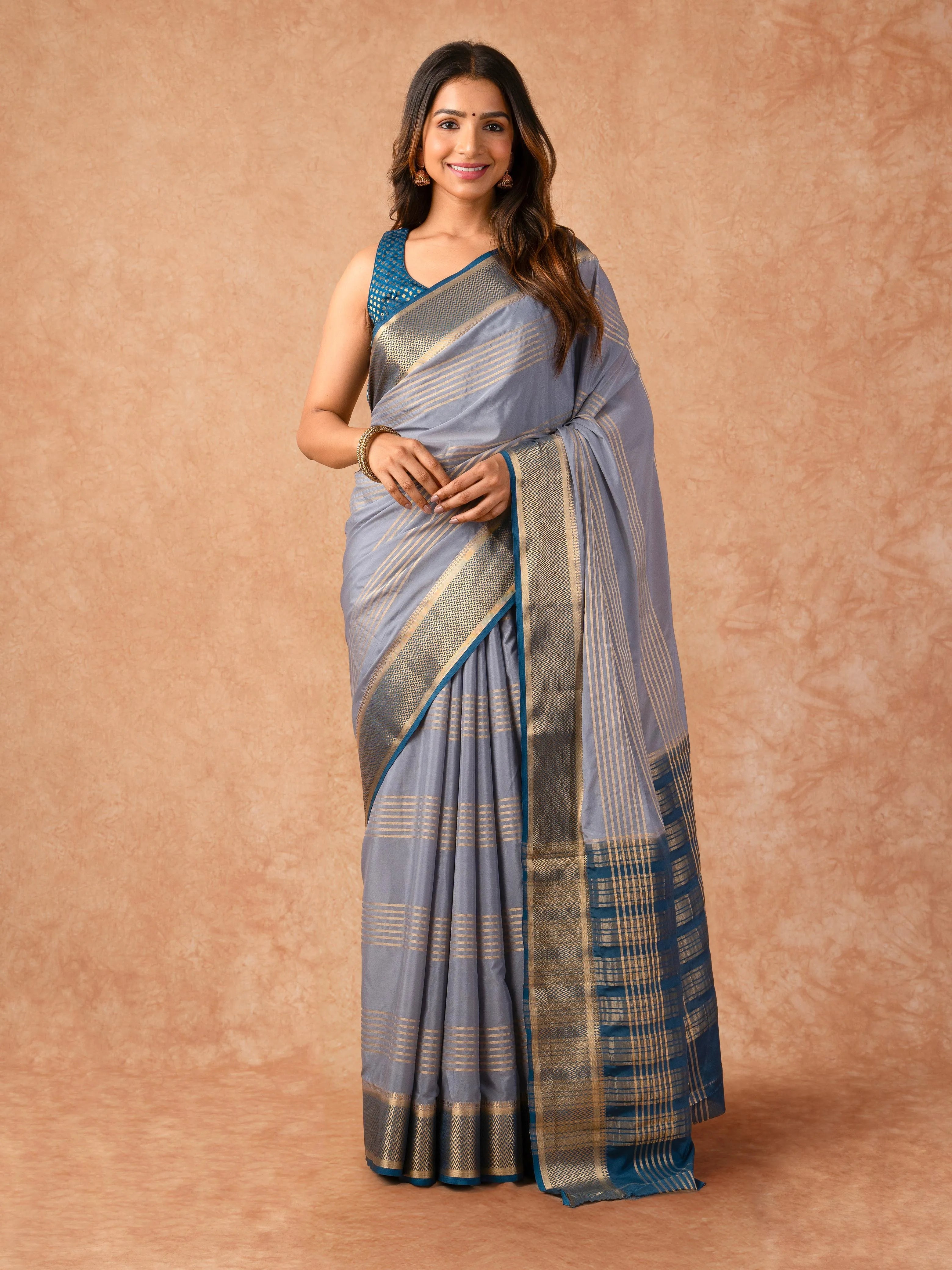 Woman wearing a Semi Crepe Silk Saree with soft drape and subtle shine, ideal for office, family gatherings, and festive occasions.
