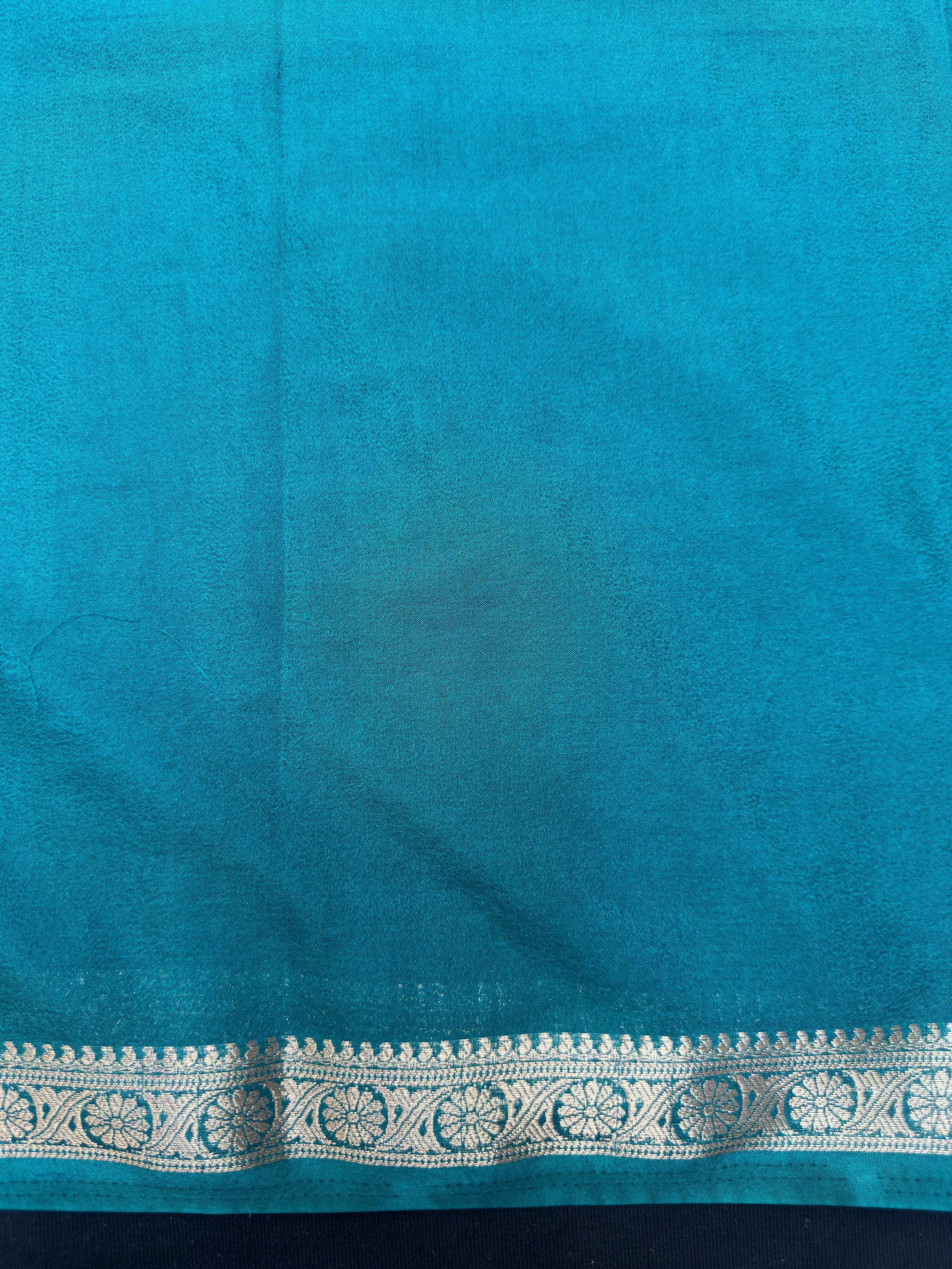 Woman draped in a Semi Crepe Silk Saree with soft texture and subtle shine, perfect for elegant office wear and festive occasions.