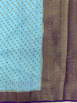 A beautifully draped Semi Banarasi Georgette Saree featuring intricate patterns and delicate weaving. The saree’s lightweight and breathable fabric ensures comfort, making it an ideal choice for daily wear. Perfectly blending traditional design with modern elegance, this saree is suitable for casual and formal occasions.