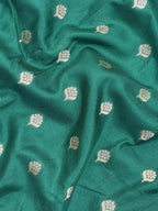 A beautifully draped Semi Banarasi Georgette Saree featuring intricate patterns and delicate weaving. The saree’s lightweight and breathable fabric ensures comfort, making it an ideal choice for daily wear. Perfectly blending traditional design with modern elegance, this saree is suitable for casual and formal occasions.