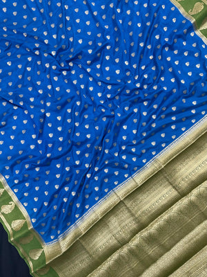 Woman wearing a Semi Khaddi Georgette Saree with soft fabric and zari highlights, ideal for festive and traditional occasions.