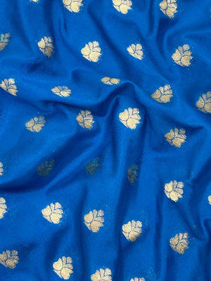 Woman wearing a Semi Khaddi Georgette Saree with soft fabric and zari highlights, ideal for festive and traditional occasions.