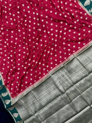 Woman wearing a Semi Khaddi Georgette Saree with soft fabric and zari highlights, ideal for festive and traditional occasions.