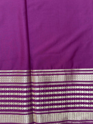 "Semi Mysore Silk Saree in a soft, breathable fabric with a smooth drape, perfect for daily wear. Subtle sheen and elegant design, ideal for both casual and formal occasions."