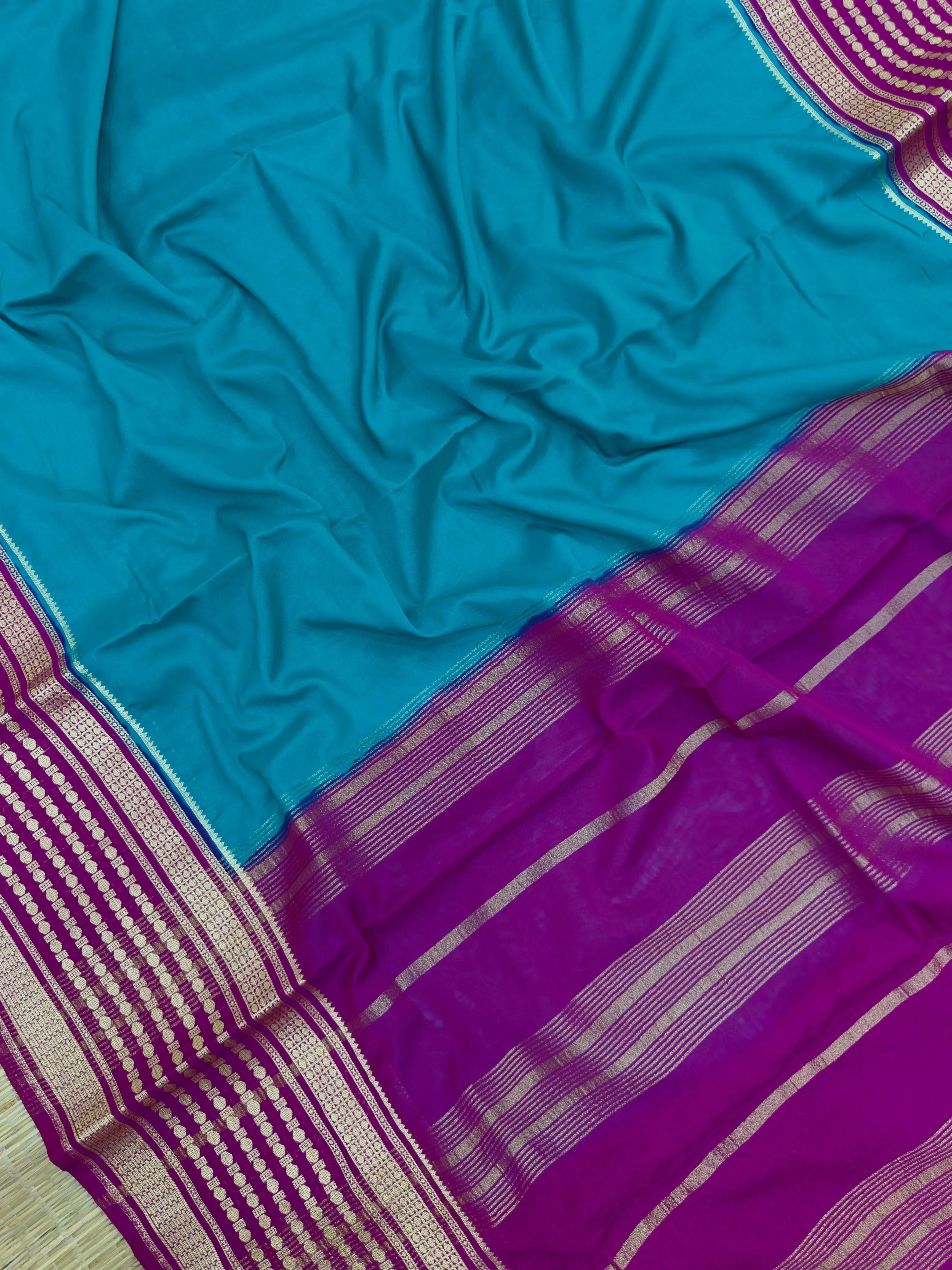 "Semi Mysore Silk Saree in a soft, breathable fabric with a smooth drape, perfect for daily wear. Subtle sheen and elegant design, ideal for both casual and formal occasions."