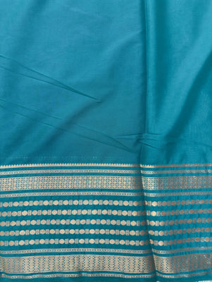 "Semi Mysore Silk Saree in a soft, breathable fabric with a smooth drape, perfect for daily wear. Subtle sheen and elegant design, ideal for both casual and formal occasions."