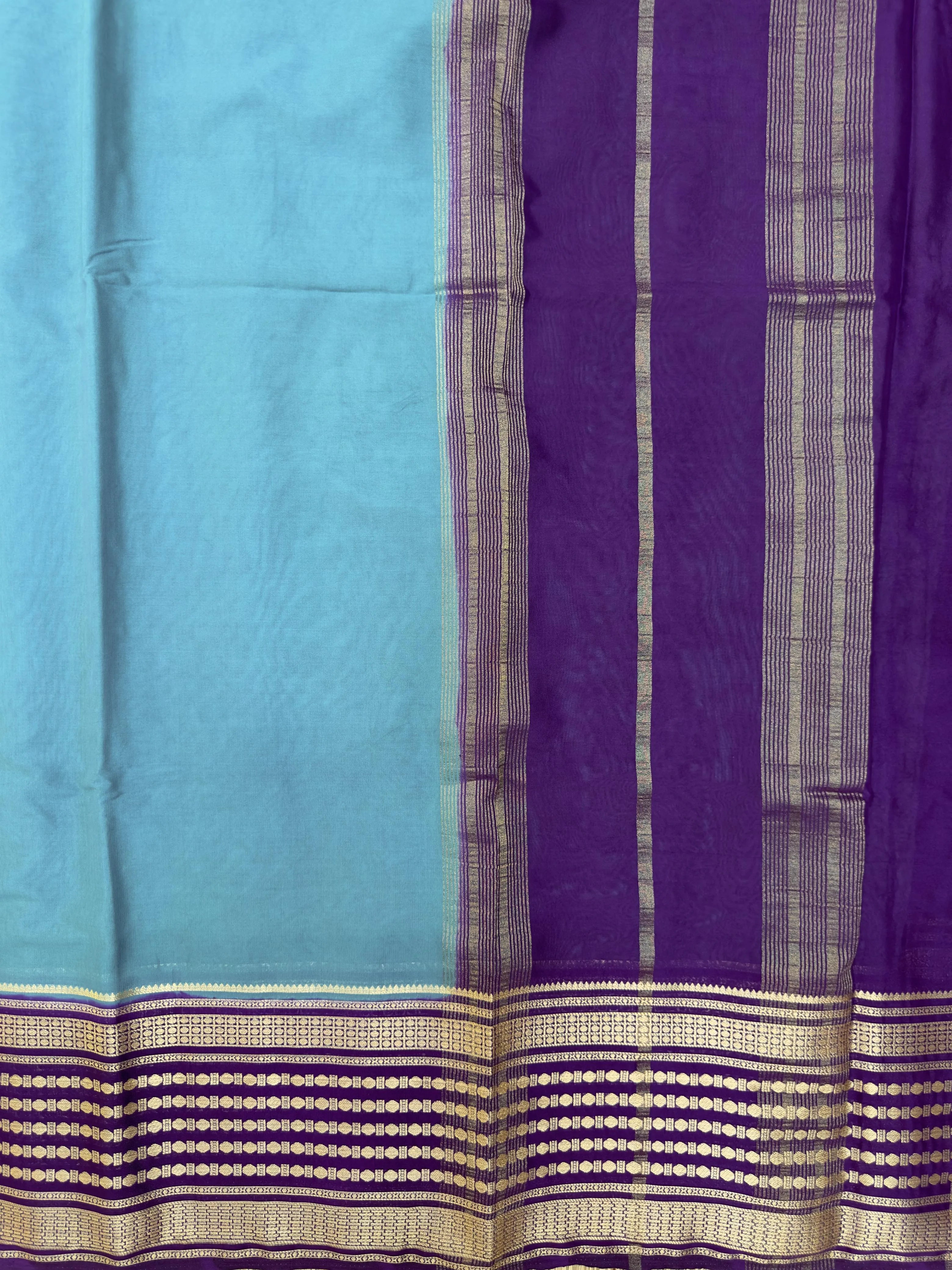 "Semi Mysore Silk Saree in a soft, breathable fabric with a smooth drape, perfect for daily wear. Subtle sheen and elegant design, ideal for both casual and formal occasions."