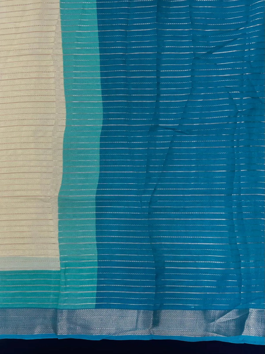 Woman wearing a Semi Silk Saree with elegant shine and festive border – perfect for ethnic functions and special occasions.