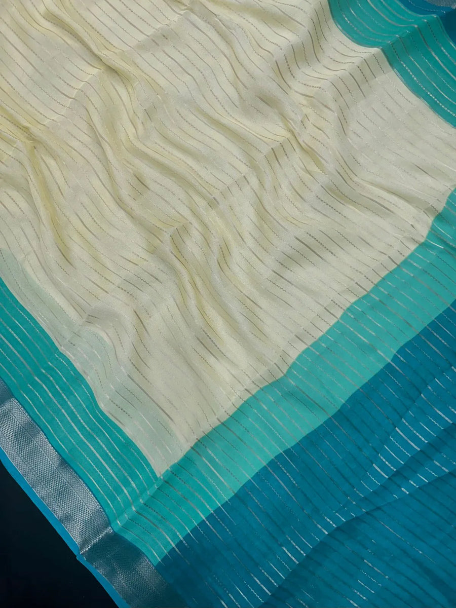 Woman wearing a Semi Silk Saree with elegant shine and festive border – perfect for ethnic functions and special occasions.