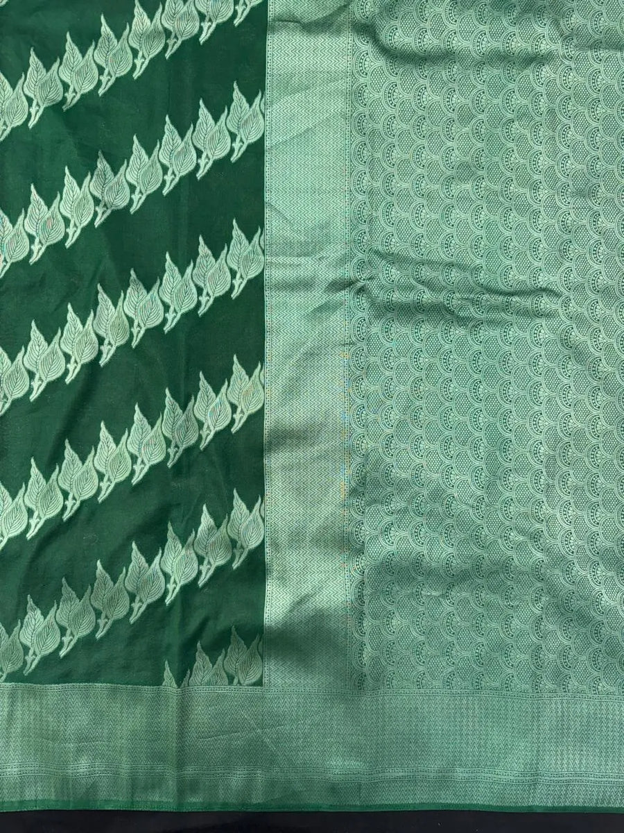 Woman wearing a Semi Silk Saree with smooth, shiny finish and lightweight fabric, ideal for festive and everyday occasions.
