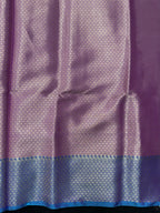 Woman wearing a Semi Silk Saree with lightweight fabric and soft sheen, ideal for weddings, festive occasions, and office wear.