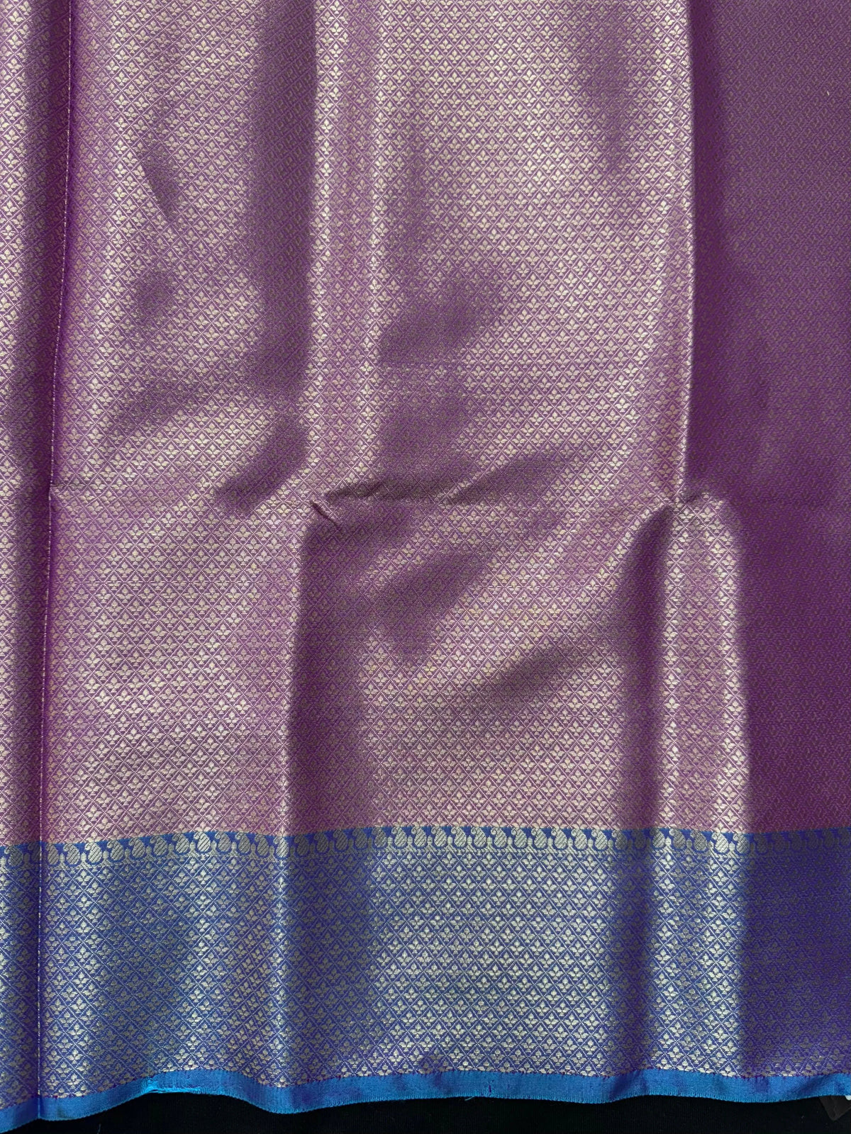 Woman wearing a Semi Silk Saree with lightweight fabric and soft sheen, ideal for weddings, festive occasions, and office wear.