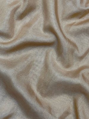 Woman draped in a Semi Crepe Silk Saree with soft texture and subtle shine, perfect for elegant office wear and festive occasions.