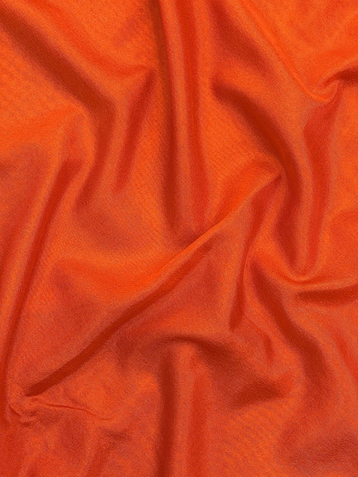 Woman draped in a Semi Crepe Silk Saree with soft texture and subtle shine, perfect for elegant office wear and festive occasions.