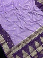 “Woman draped in a Semi Khaddi Georgette saree featuring intricate Banarasi motifs and a soft, flowy texture—perfect blend of tradition and lightness.”