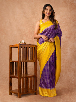 “Woman draped in a Semi Khaddi Georgette saree featuring intricate Banarasi motifs and a soft, flowy texture—perfect blend of tradition and lightness.”