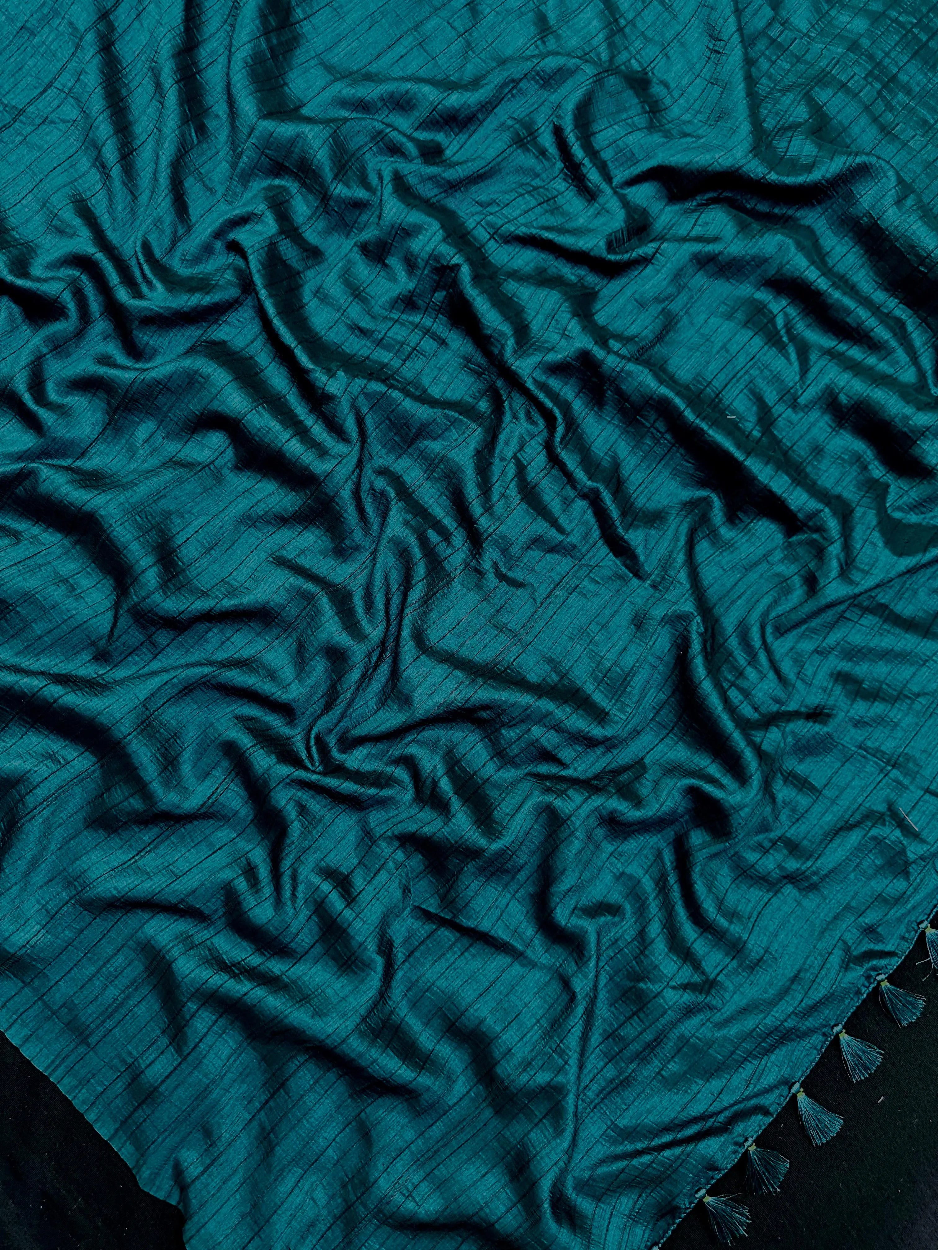 Woman draped in a Soft Tussar Silk Saree with subtle shine and fluid texture, ideal for elegant everyday and festive occasions.