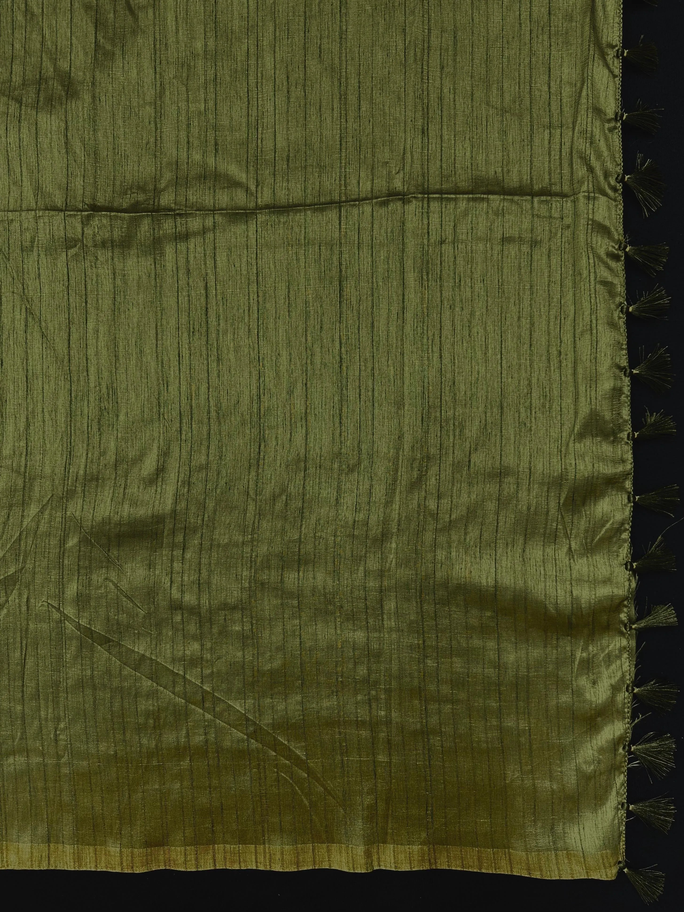 Woman draped in a Soft Tussar Silk Saree with subtle shine and fluid texture, ideal for elegant everyday and festive occasions.