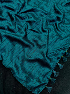 Woman draped in a Soft Tussar Silk Saree with subtle shine and fluid texture, ideal for elegant everyday and festive occasions.