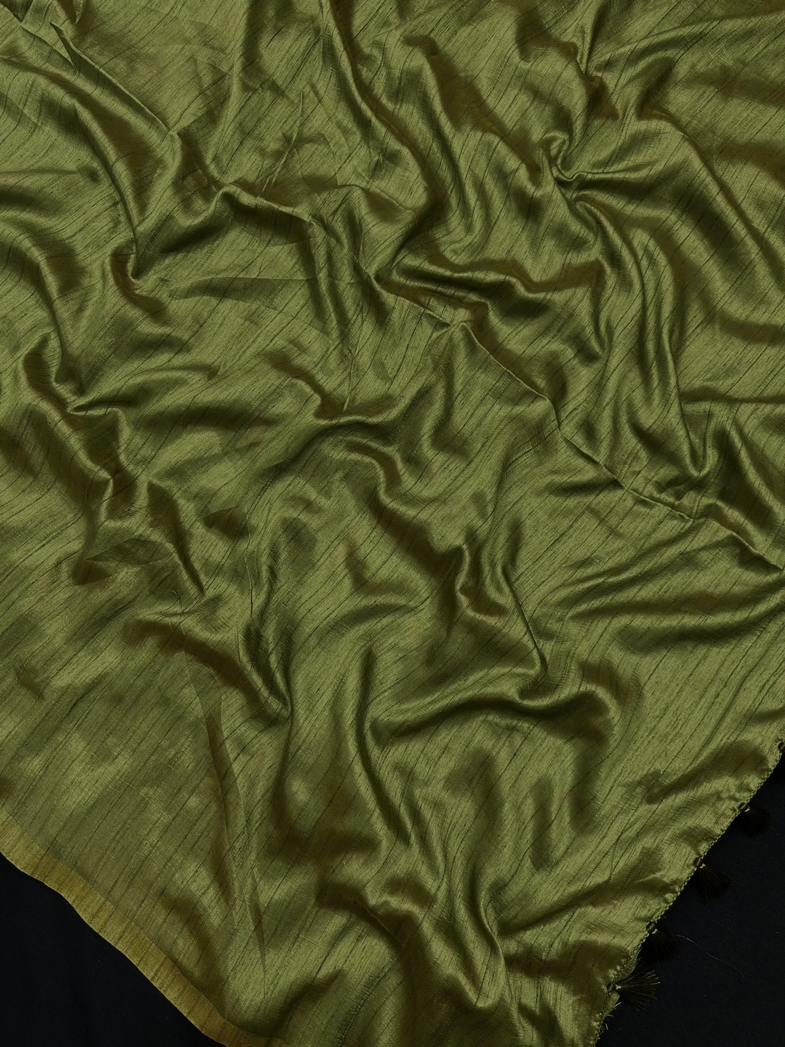 Woman draped in a Soft Tussar Silk Saree with subtle shine and fluid texture, ideal for elegant everyday and festive occasions.