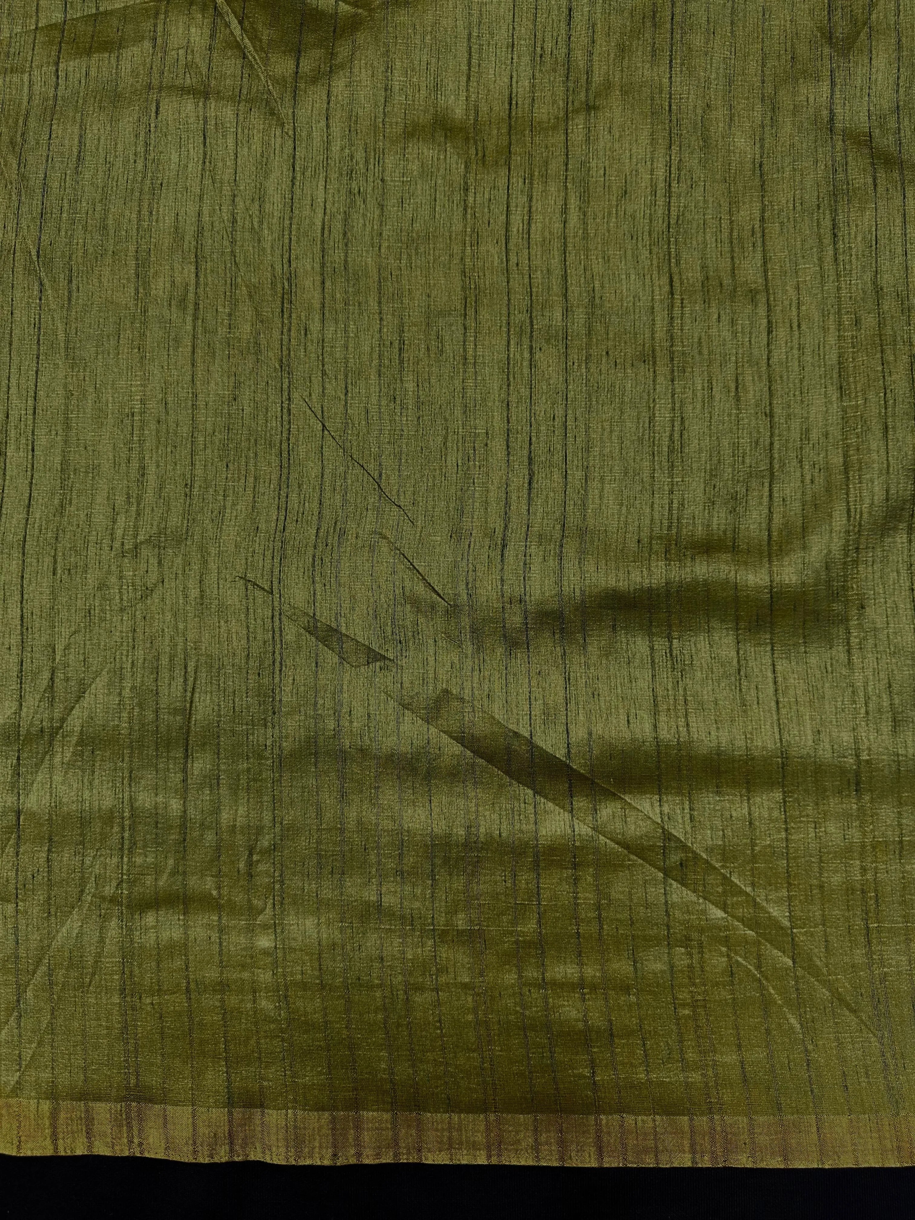 Woman draped in a Soft Tussar Silk Saree with subtle shine and fluid texture, ideal for elegant everyday and festive occasions.