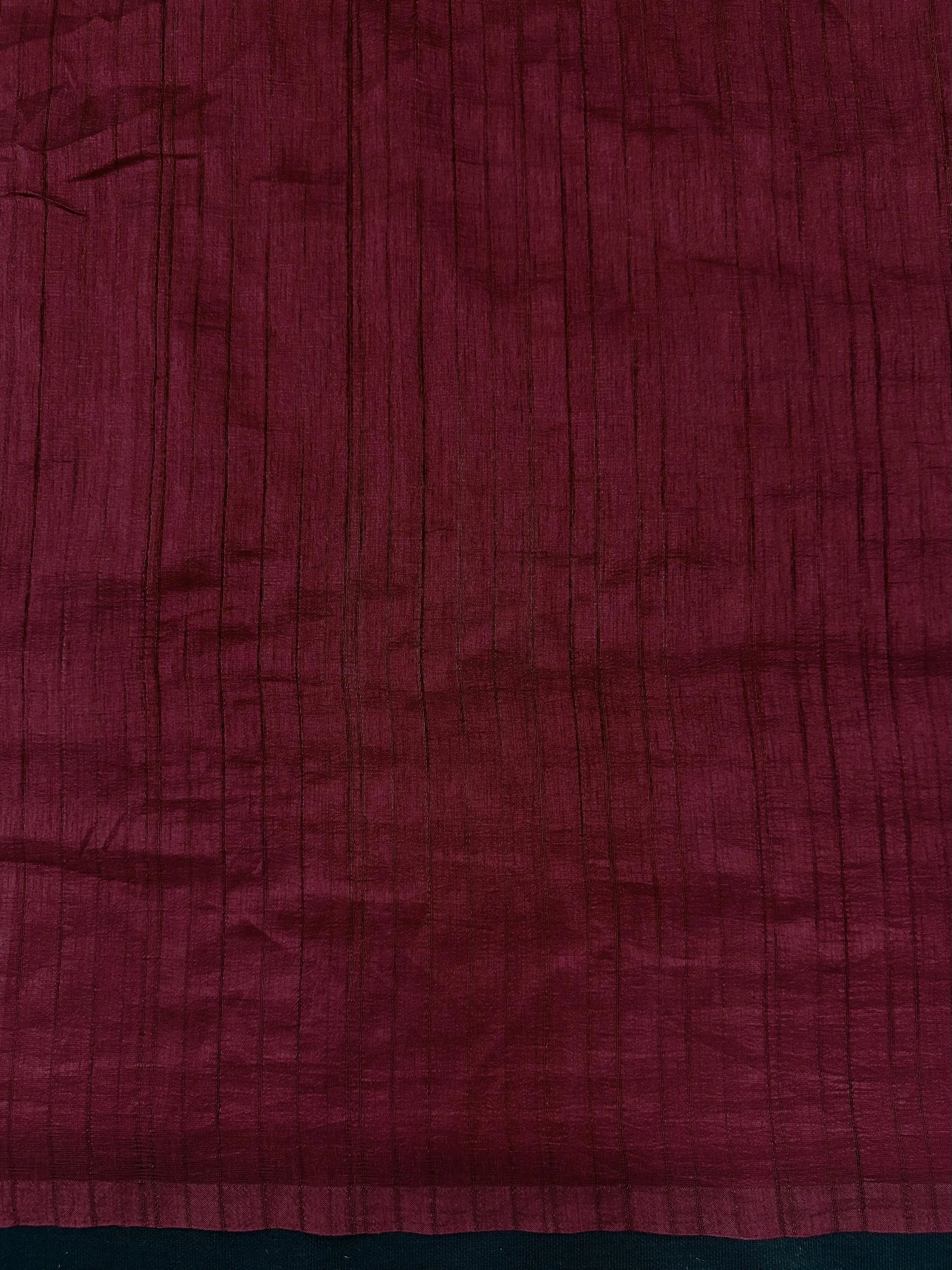 Woman draped in a Soft Tussar Silk Saree with subtle shine and fluid texture, ideal for elegant everyday and festive occasions.