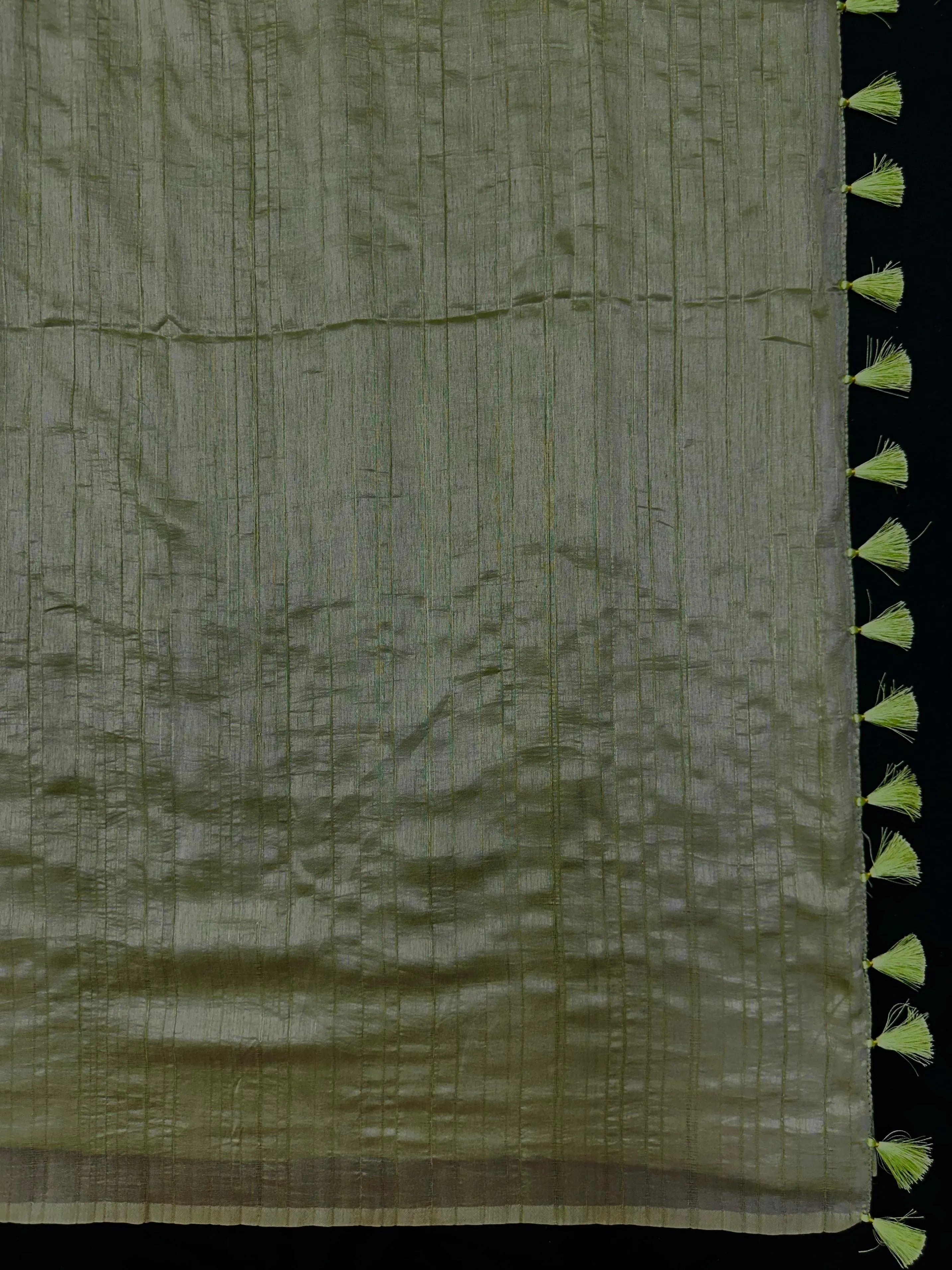 Woman draped in a Soft Tussar Silk Saree with subtle shine and fluid texture, ideal for elegant everyday and festive occasions.
