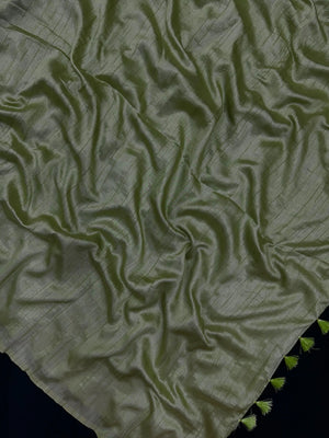Woman draped in a Soft Tussar Silk Saree with subtle shine and fluid texture, ideal for elegant everyday and festive occasions.