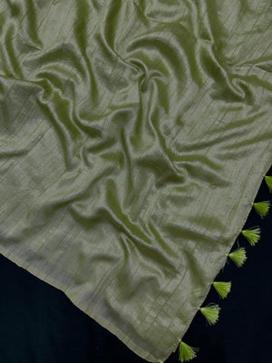 Woman draped in a Soft Tussar Silk Saree with subtle shine and fluid texture, ideal for elegant everyday and festive occasions.