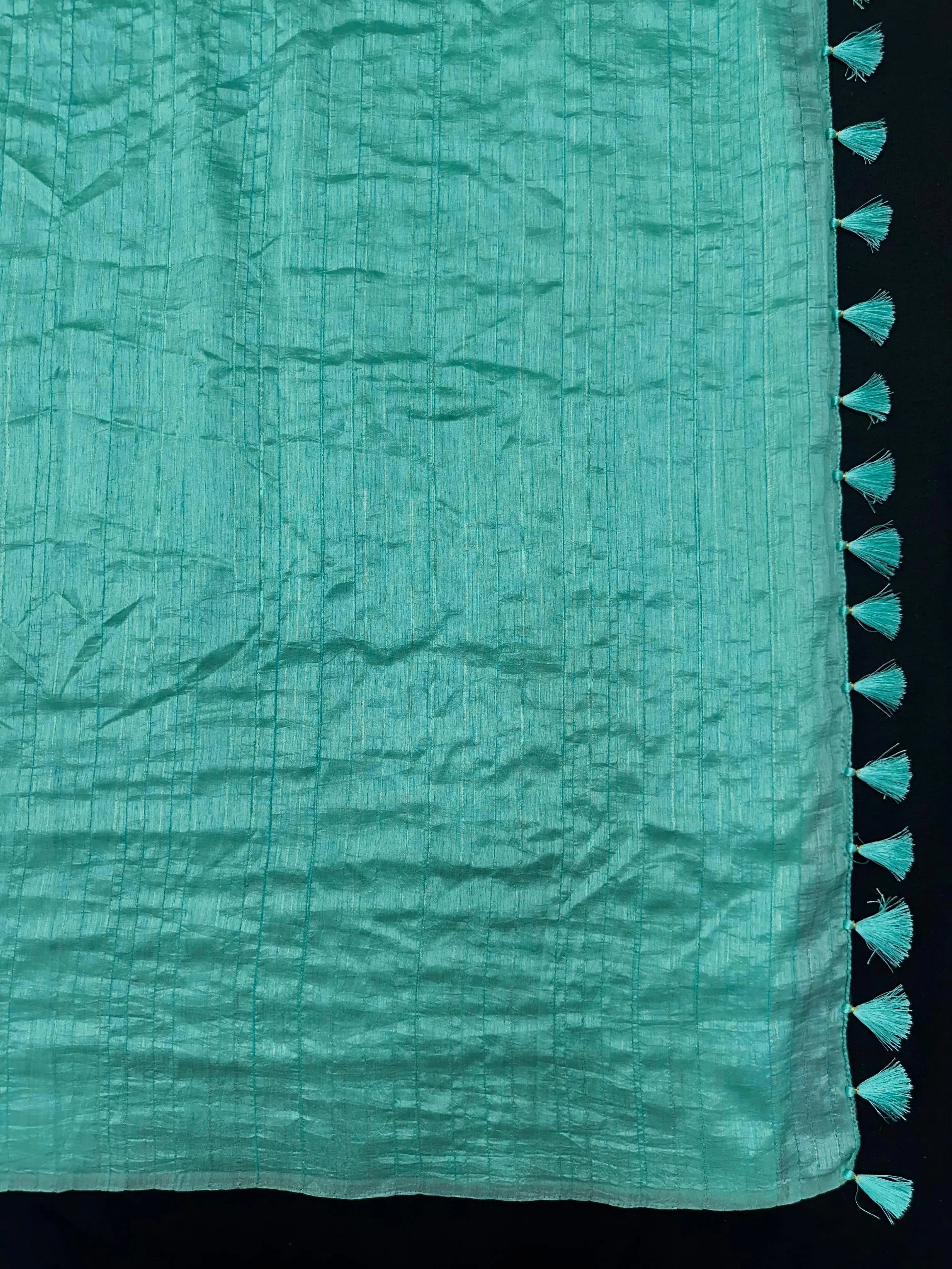 Woman draped in a Soft Tussar Silk Saree with subtle shine and fluid texture, ideal for elegant everyday and festive occasions.