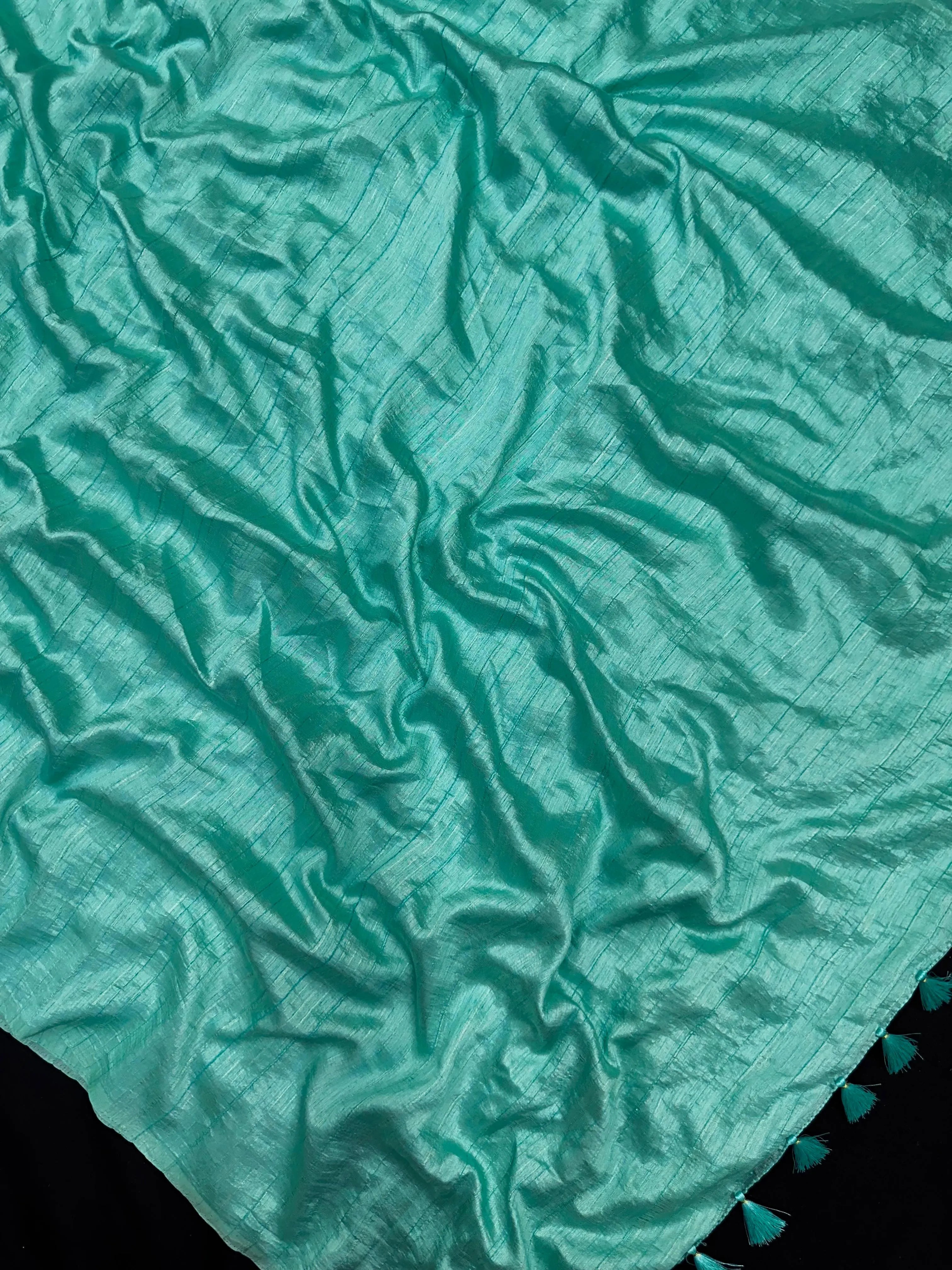 Woman draped in a Soft Tussar Silk Saree with subtle shine and fluid texture, ideal for elegant everyday and festive occasions.