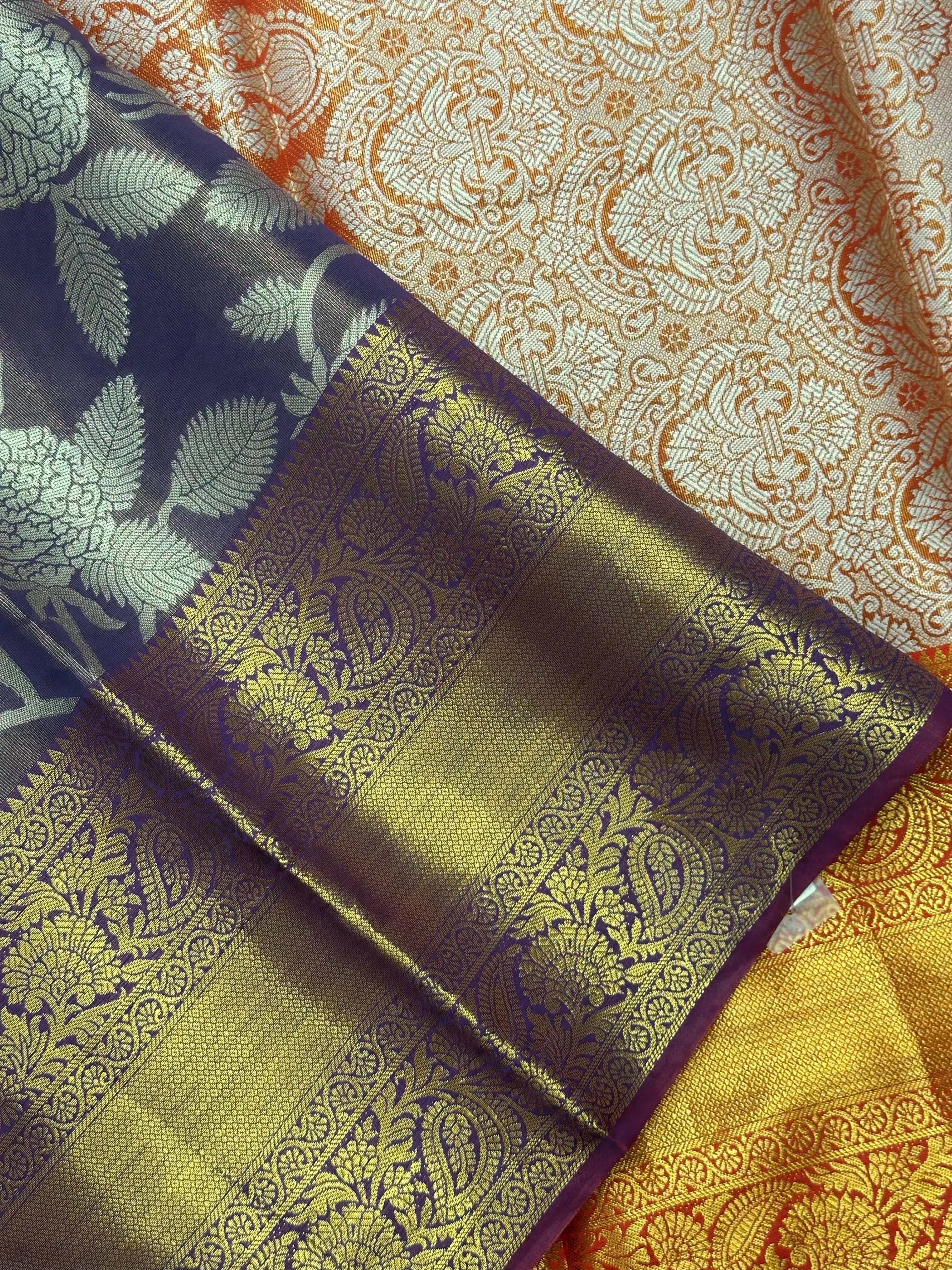 Model draped in a shimmering Tissue Banarasi Silk Saree with zari border, ideal for wedding and festive celebrations.
