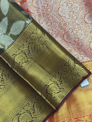 Model draped in a shimmering Tissue Banarasi Silk Saree with zari border, ideal for wedding and festive celebrations.