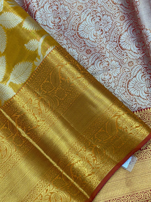 Model draped in a shimmering Tissue Banarasi Silk Saree with zari border, ideal for wedding and festive celebrations.