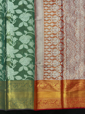Model draped in a shimmering Tissue Banarasi Silk Saree with zari border, ideal for wedding and festive celebrations.