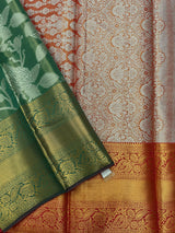 Model draped in a shimmering Tissue Banarasi Silk Saree with zari border, ideal for wedding and festive celebrations.