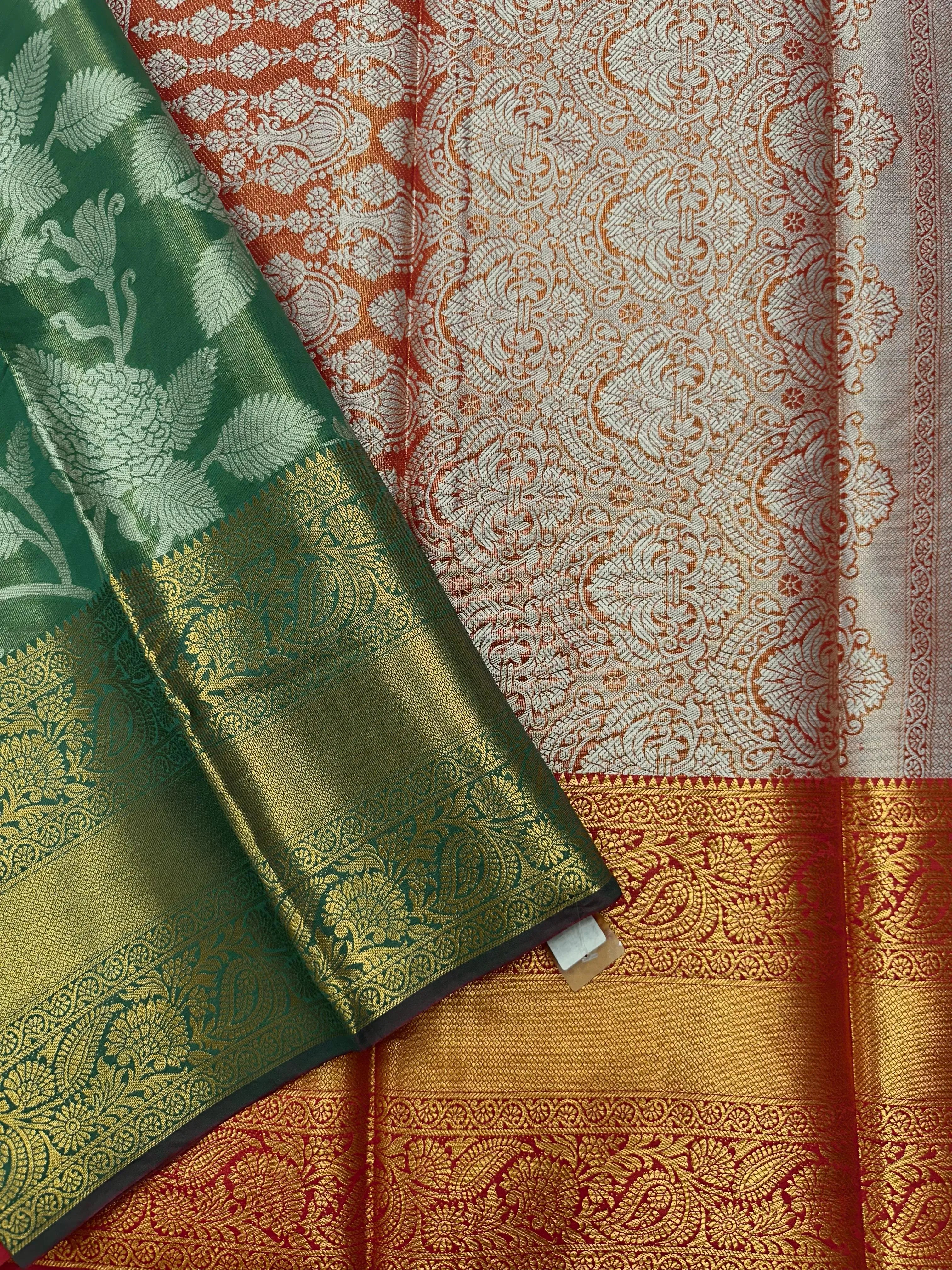 Model draped in a shimmering Tissue Banarasi Silk Saree with zari border, ideal for wedding and festive celebrations.