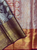 Model draped in a shimmering Tissue Banarasi Silk Saree with zari border, ideal for wedding and festive celebrations.